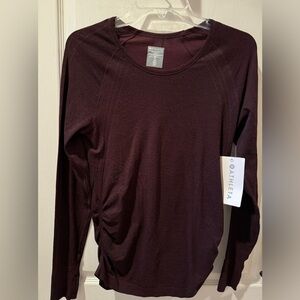 ATHLETA woman’s speed light tethered top size medium in antique burgundy
